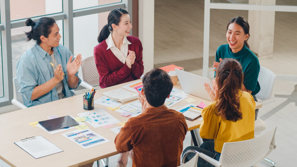 Marketing interns engaged in a group discussion.