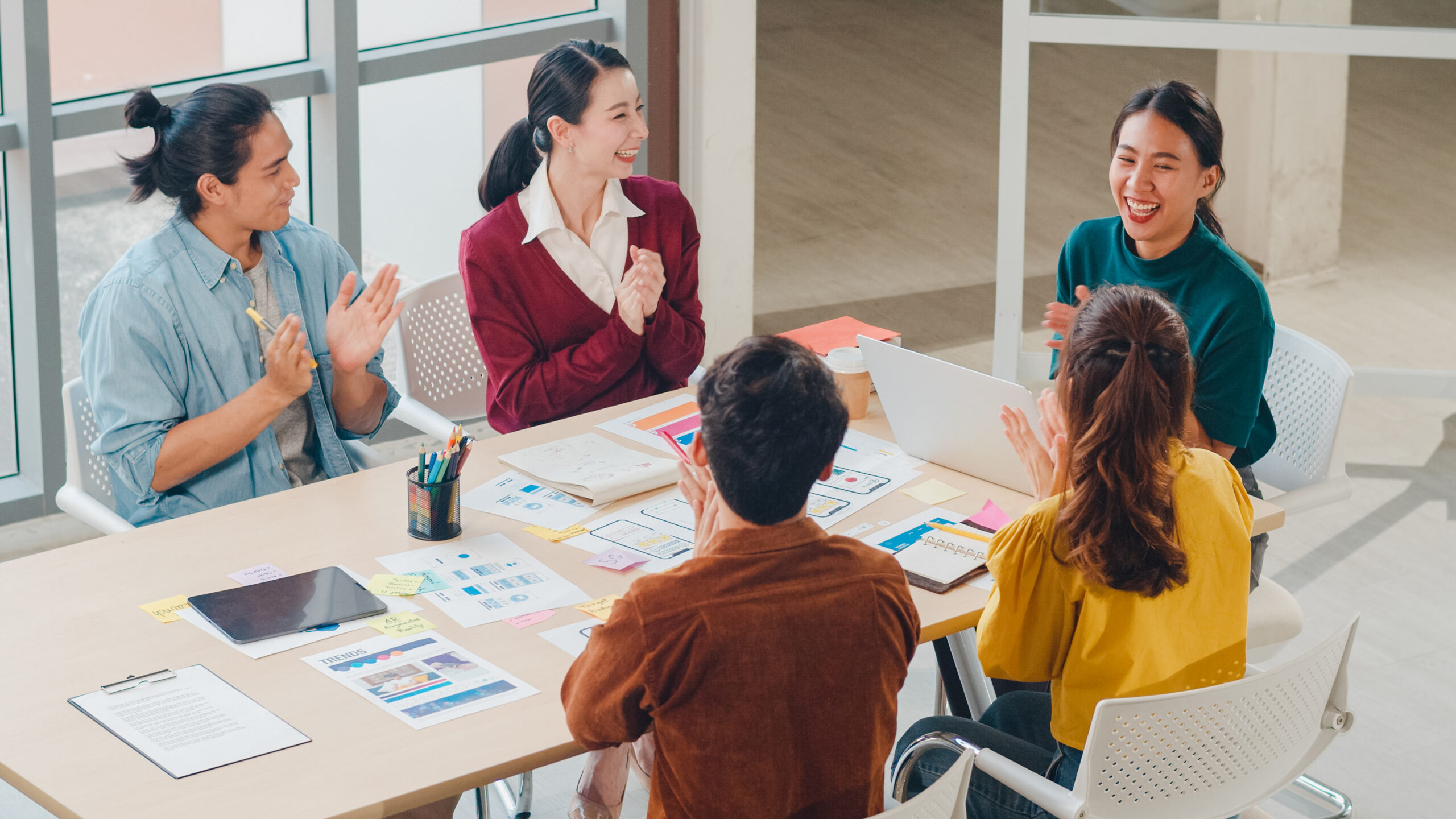 Marketing interns engaged in a group discussion.
