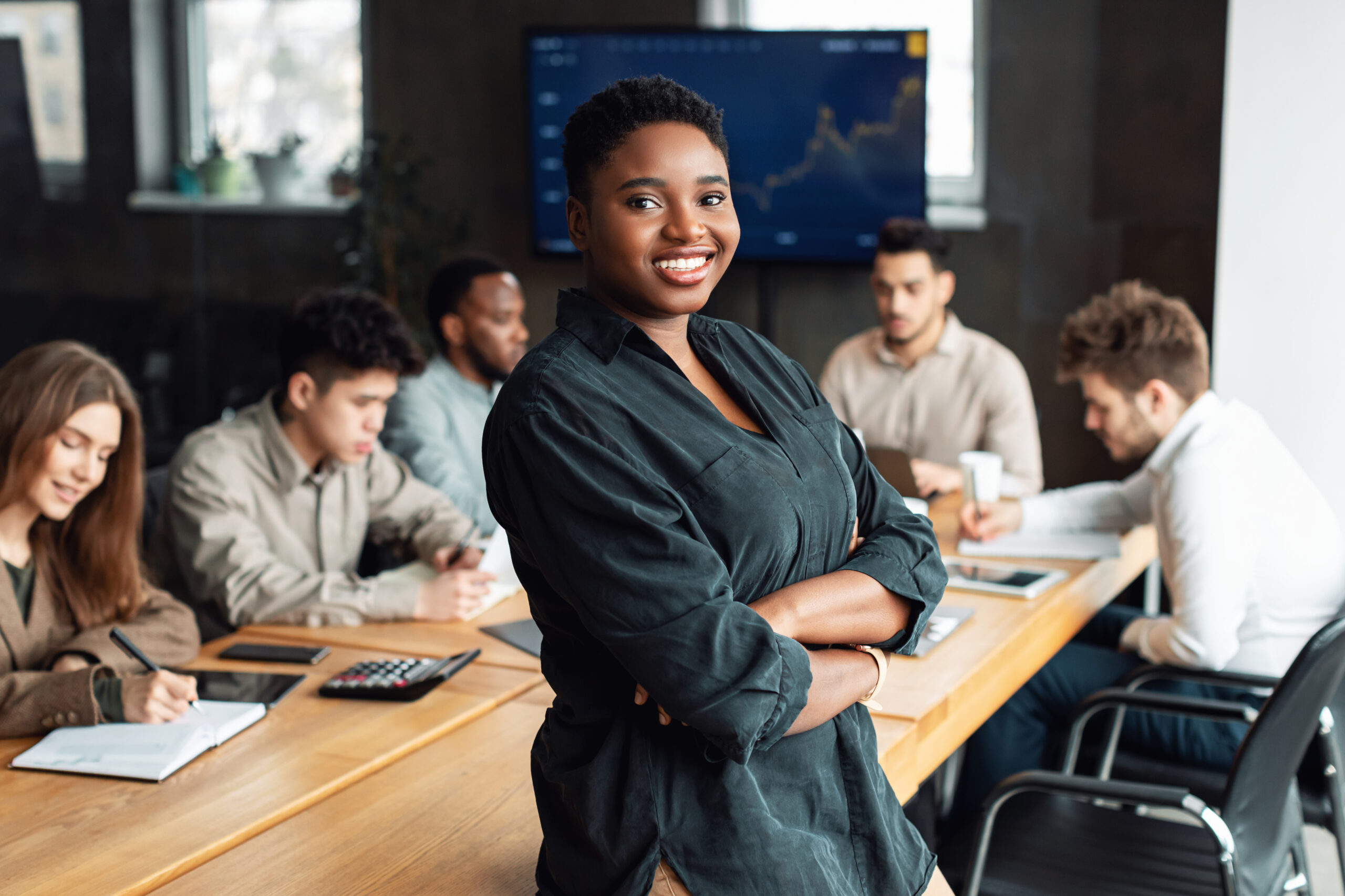Motivated professional in a collaborative office, showcasing a full-time job.